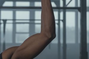 Male athlete focusing on hand grip strength training